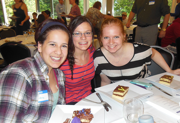 Photo of three students sitting around table, link to First in the Family web page