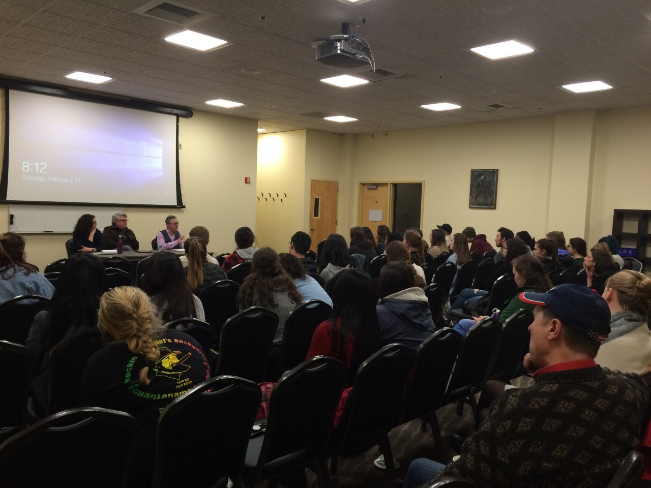 Audience at night school panel discussion.