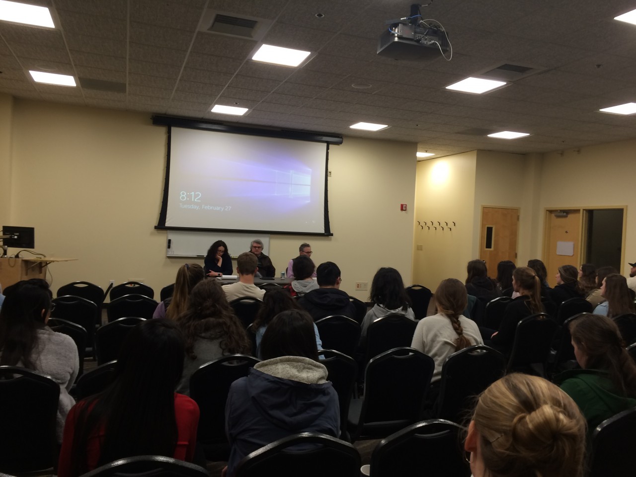 Audience at night school panel discussion.