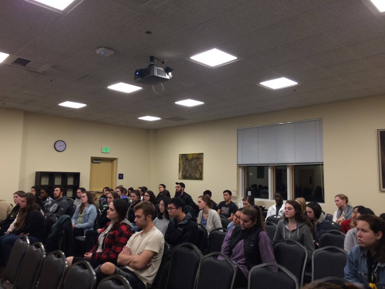 Audience at night school panel discussion.