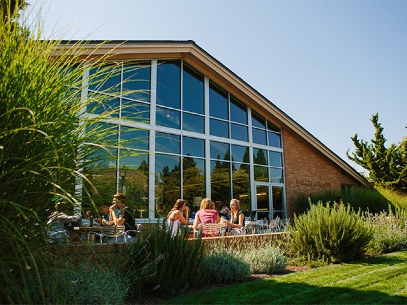 Front of Bauccio Commons with the patio tables filled.