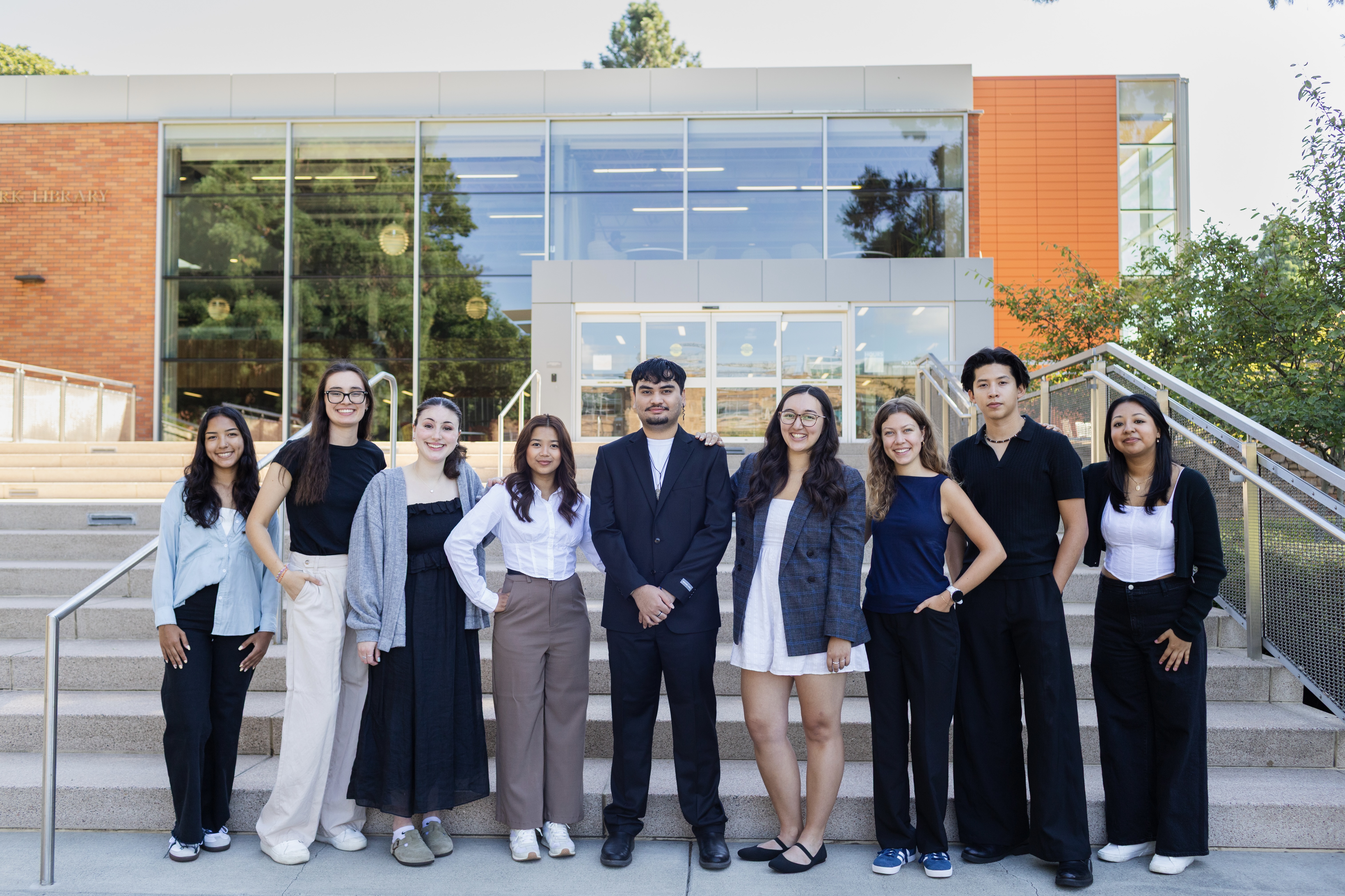 25-26 CPB Staff standing in front of steps on campus