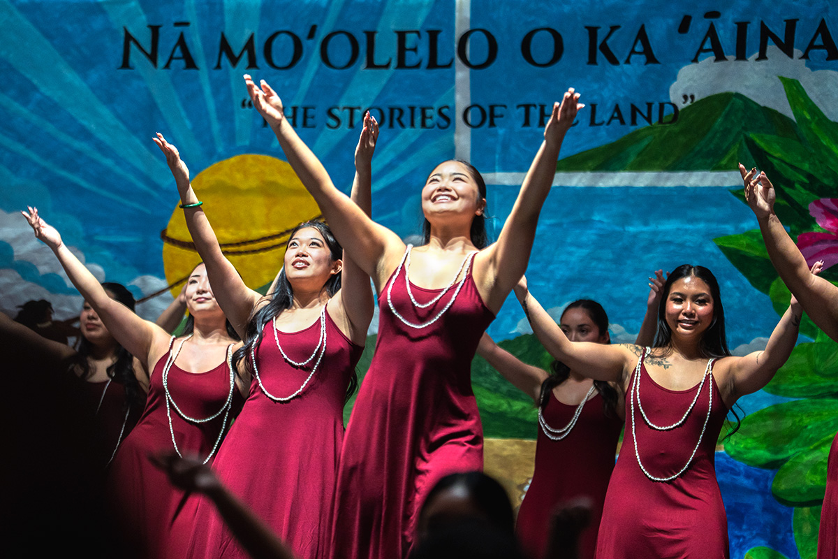students perform a traditional dance at the hawaii club luau