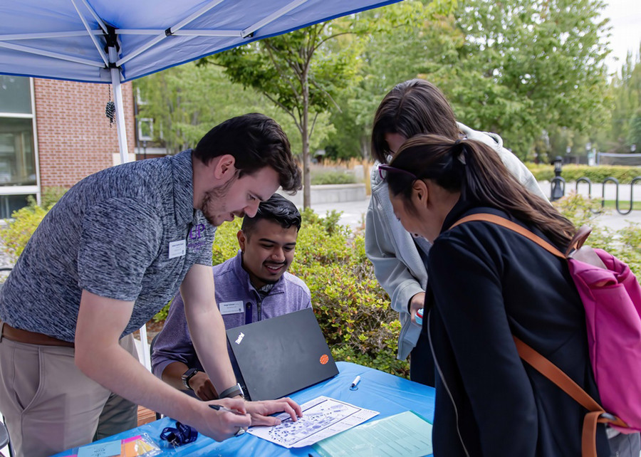Resident advisors assist new Pilots at the dorm on move in day at UP.