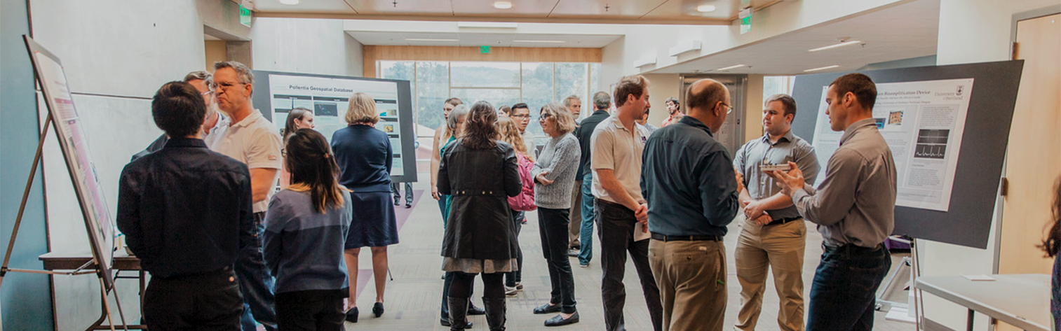 Students talking at research poster session